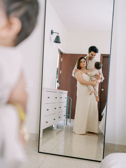 Using a mirror for a creative family portrait. It adds a layer of depth and artistry to this beautiful at-home lifestyle shot.