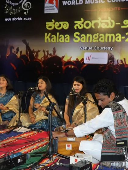 A Hindustani vocal trio performs a Chota Khayal in Raag Miya Malhar, accompanied by harmonium and tabla.