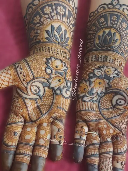 A stunning design using negative space to create a bold effect. The lotus and paisley patterns are highlighted by the dark-filled background, creating a modern yet traditional feel.