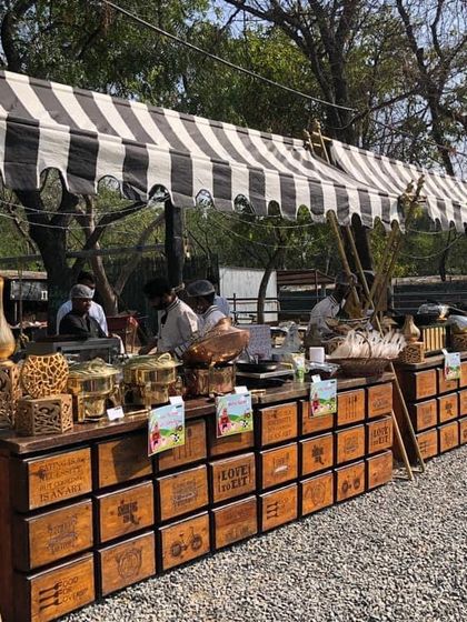 An 'Old MacDonald Had a Farm' themed birthday party. I used these rustic wooden crate-style counters and a striped canopy to create a charming farm-like atmosphere for the buffet.