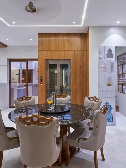 This project even includes a personal lift, seamlessly integrated into the dining area with wood paneling. It’s a perfect example of how I incorporate accessibility and luxury into my designs.