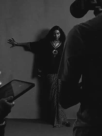 Capturing the poetry of a moment. This behind the scenes shot shows the full team at work, with the camera operator and me working in sync to bring a creative vision to life through careful lighting and composition.