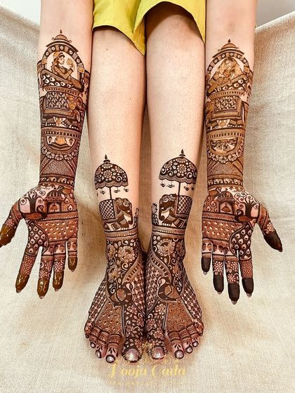 A full bridal look featuring royal elephants and other traditional figures on both hands and feet, creating a majestic and cohesive appearance.