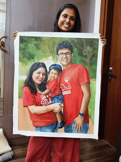 Me holding the large, completed family portrait on an un-stretched canvas.
