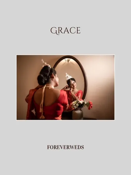 Grace in the mirror. A classic getting-ready shot of the bride, Bhawana, as she puts on her earrings. This perspective adds depth and tells the story of her transformation.