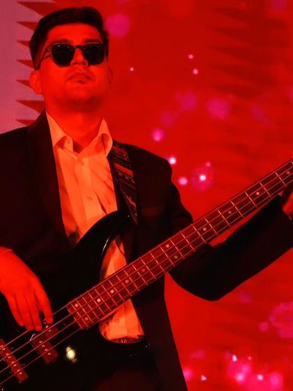 A close-up of our bassist, completely in the zone during the performance at Taj Yeshwantpur.