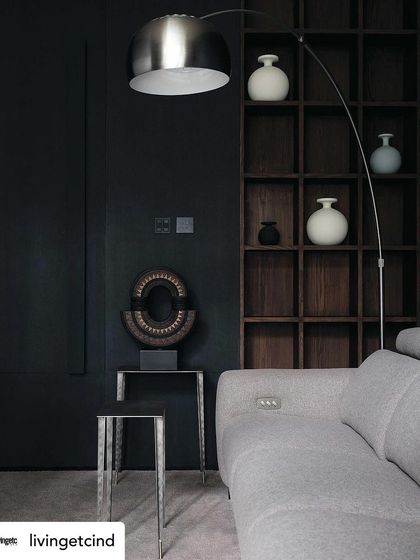 The dark and cozy family lounge, a perfect retreat for watching movies. This space was highlighted in our Livingetc magazine feature.