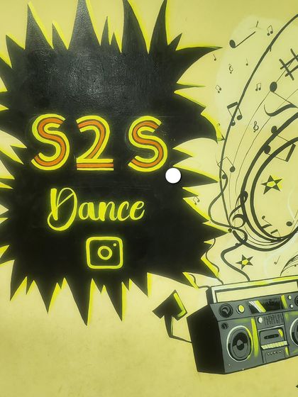 The S2S Dance logo on our studio wall. This is where the magic begins, with music and movement coming together.