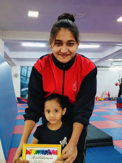 Happiness is elevating yourself to higher levels. This student is awarded for her progress.