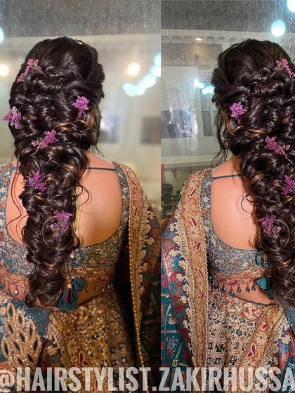 A dual-angle view of the voluminous bubble braid with purple flowers, highlighting its intricate texture.