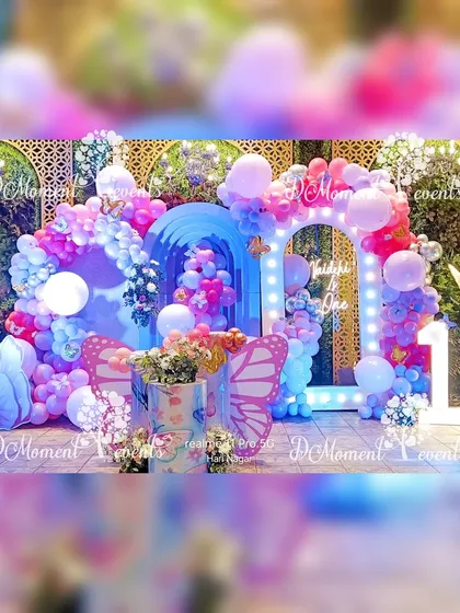A beautifully saturated shot of the butterfly-themed stage, with dramatic pink and blue lighting creating a vibrant and dreamlike effect.