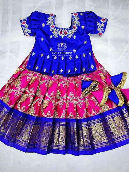 A 6-month-old's Pattu lehenga in blue and pink, with cascading tassels. All sizes can be customized.