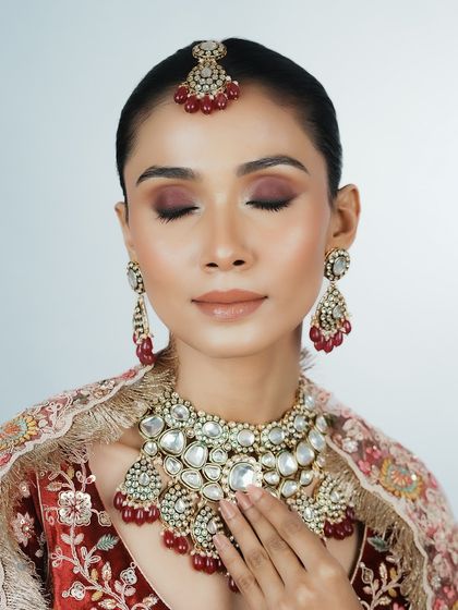 The focus here is on the overall harmony of the makeup with the heavy jewelry. I teach how to create a look that is glamorous yet not overpowering.