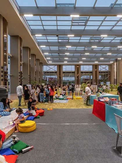 I believe in creating spaces that foster community. This glass pavilion, one of the first of its kind in India, is a 40-foot-high, light-filled hall where a sprawling lawn extends indoors, blurring the line between the built environment and nature for gatherings and events.
