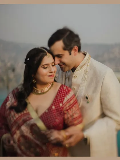 A soft and dreamy portrait of the couple, their faces close in a moment of quiet intimacy. The gentle focus and warm tones create a romantic and timeless feel.