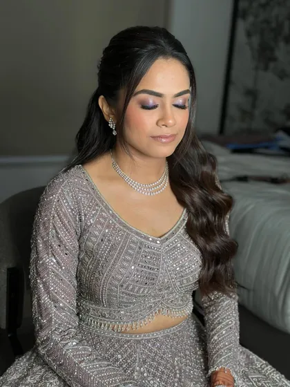 Another angle of the shimmering eye makeup. The blend is seamless, creating a dramatic effect that is still sophisticated and elegant.