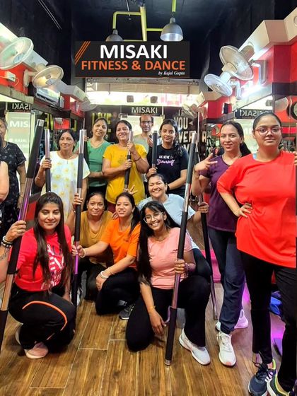 Our happy members after a challenging workout session using fitness rods for toning and strength training.