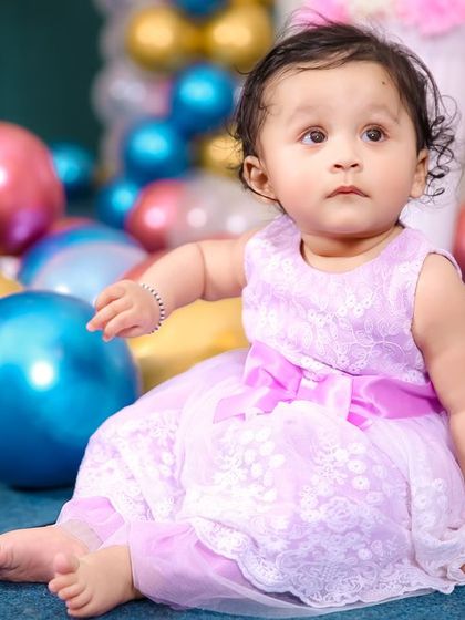 A charming 'Farm' themed birthday party, with rustic decor, animal cutouts, and hay bale props, perfect for a country-style celebration.