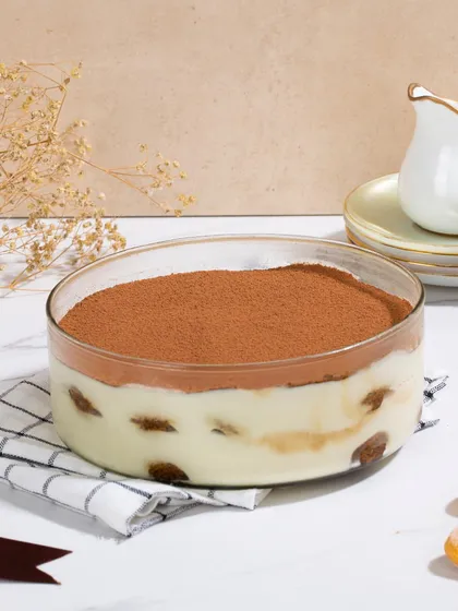 My signature Tiramisu, featuring layers of espresso-dipped Savoiardi biscuits and rich mascarpone cream.