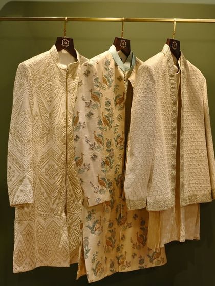 A trio of our ceremonial jackets, showcasing a range of styles from geometric patterns to floral prints and textured weaves. Each piece is designed to offer a distinct personality for any wedding event.