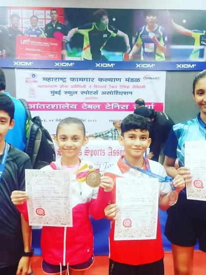 Our four medalists from the MSSA tournament 2022, Vedika, Aakarshan, Ryan, and Vaishnavi, showcasing their gold and silver medals.