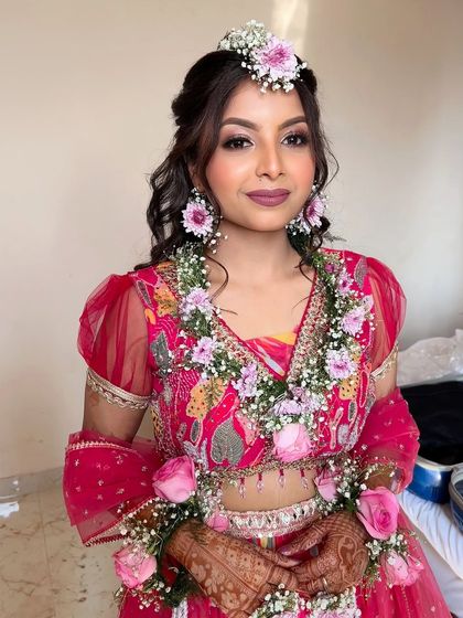 The final Haldi look. She looks fresh, happy, and absolutely beautiful, ready for her flower shower.