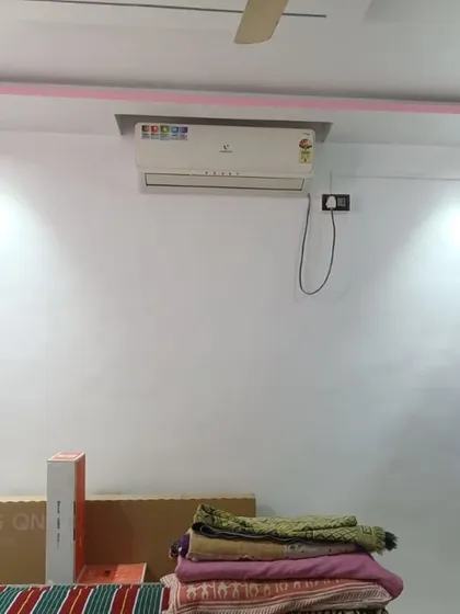 A simple yet effective false ceiling with a pink-accented border and integrated spotlights. This project also included fresh interior wall painting to complete the room's updated look.