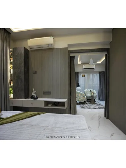 A view from the bed in the Duplex Project's master suite, looking towards the private seating area. This layout creates a sense of a luxurious, multi-zone retreat.