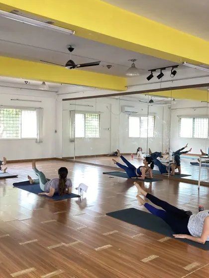 A class in session, working on a side-lying leg series. This is a great example of how we target specific muscles like the outer thighs and glutes, all while keeping the energy high.