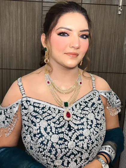 A wider shot showing how the colorful necklace, earrings, and bangles come together for a festive party look.