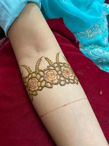 The initial outline of a floral armband. This shows the precision and care that goes into creating the foundation of every intricate design.