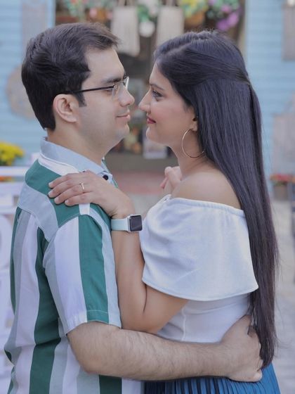 A casual and playful pre-wedding look. The makeup is fresh and natural, perfect for capturing their fun-loving personalities.