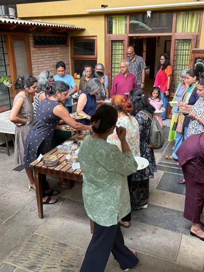 This is what a 'Koota' or gathering looks like. Our outdoor courtyard filled with people sharing food and laughter during a Local Food Club potluck. Community is at the center of everything we do, and nothing brings people together like good food and great conversation.
