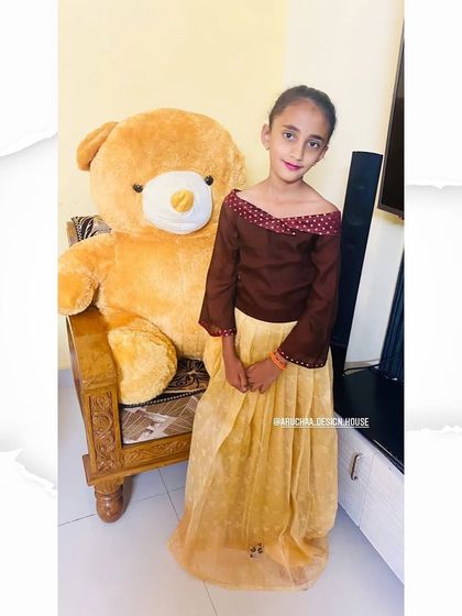 Another look at the custom pleated skirt and off-shoulder top for a young client. This full-length view shows how the two pieces come together to create a comfortable yet stylish ethnic outfit for kids.