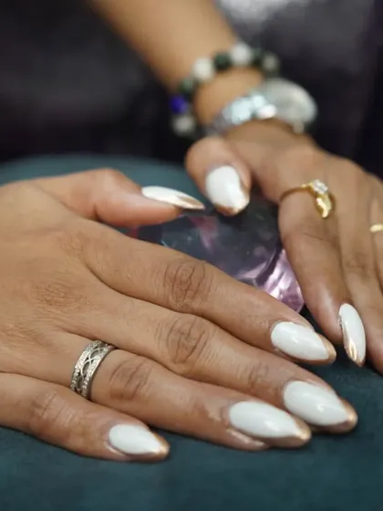 A classic and chic set of white nails with a modern twist. I added a chrome gold "drip" effect along the tips for a touch of liquid-metal glamour.