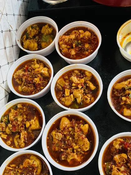 Several orders of my chicken curry, ready to be sent out to my customers.