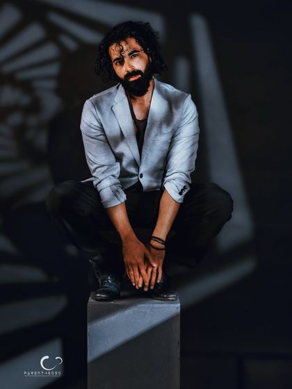 The same setup, but with a more direct and challenging gaze. This shot demonstrates how subtle changes in expression can completely alter the narrative of a portrait.