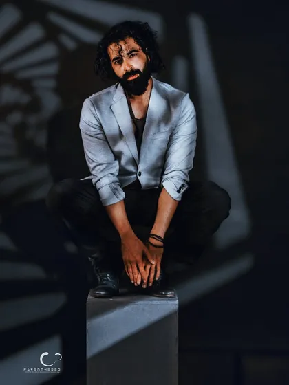 The same setup, but with a more direct and challenging gaze. This shot demonstrates how subtle changes in expression can completely alter the narrative of a portrait.