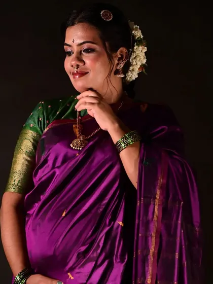 A happy, glowing portrait of the mother-to-be. The makeup is natural yet polished, enhancing her features and capturing her joy.