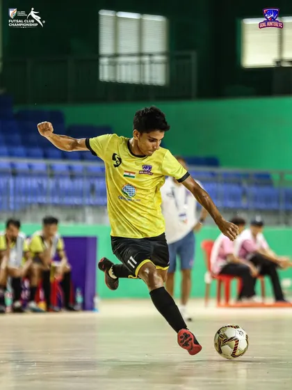 A player taking a shot on goal during the third group stage match.