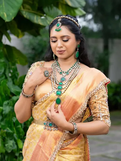 This look from my 'Athiloka Sundari' series features me in a pure Kanchi saree. I paired it with a blouse adorned with intricate embroidery and semi-precious stone embellishments, creating a regal outfit designed to make any bride feel like a princess.