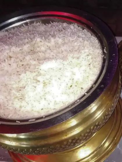 Even the simplest dishes are made with care. This is our perfectly cooked Jeera Rice, served in a traditional brass pot. It's the ideal, simple accompaniment to our flavourful curries and dals.
