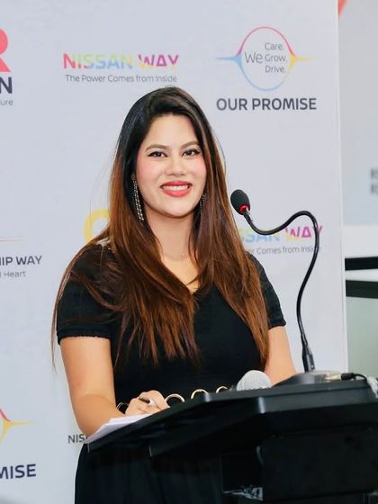 At the podium for a Nissan town hall event. I can switch from fun and games to a more formal presentation style as needed.