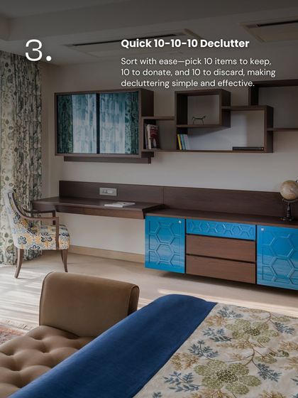 Our blog on decluttering highlights the "10-10-10" method. This image of a well-organized study area shows how keeping surfaces clear allows the custom blue and wood credenza to become a beautiful and functional focal point.