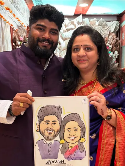 A happy couple posing with their personalized caricature, complete with their couple hashtag. It's a wonderful way to capture the spirit of their relationship.