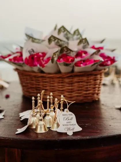 It's the little details that make a wedding special. For this ceremony, guests were given bells to ring and wish the couple well, along with cones of flower petals.
