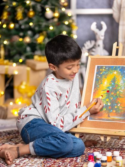 "Christmas is about opening our hearts." This young artist is capturing the magic of the season on his canvas in our festive studio.