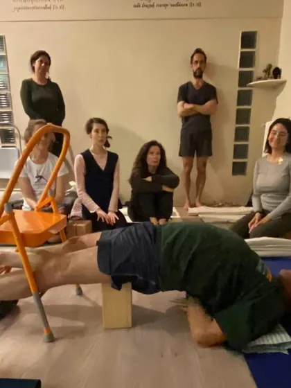 A restorative pose with a chair.