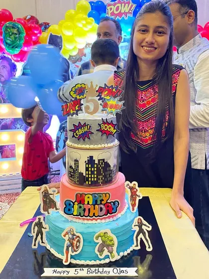 Me with the 4-tier Avengers theme cake. It was an honor to create this centerpiece for Ojas's 5th birthday celebration.