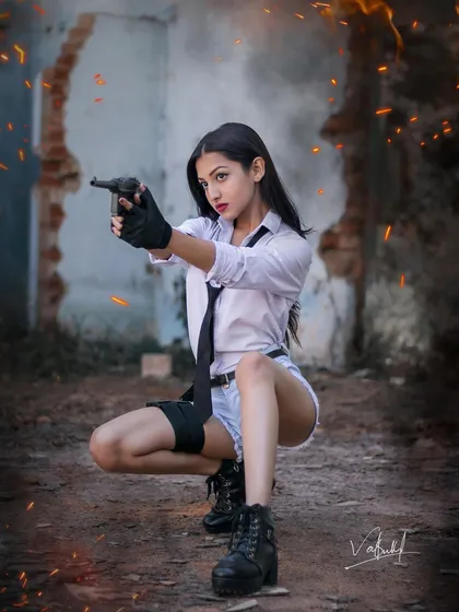 A low-angle action pose from our PUBG conceptual shoot. The model is crouched and aiming, creating a sense of immediate action, with sparks and a dramatic edit completing the battle-ready look.